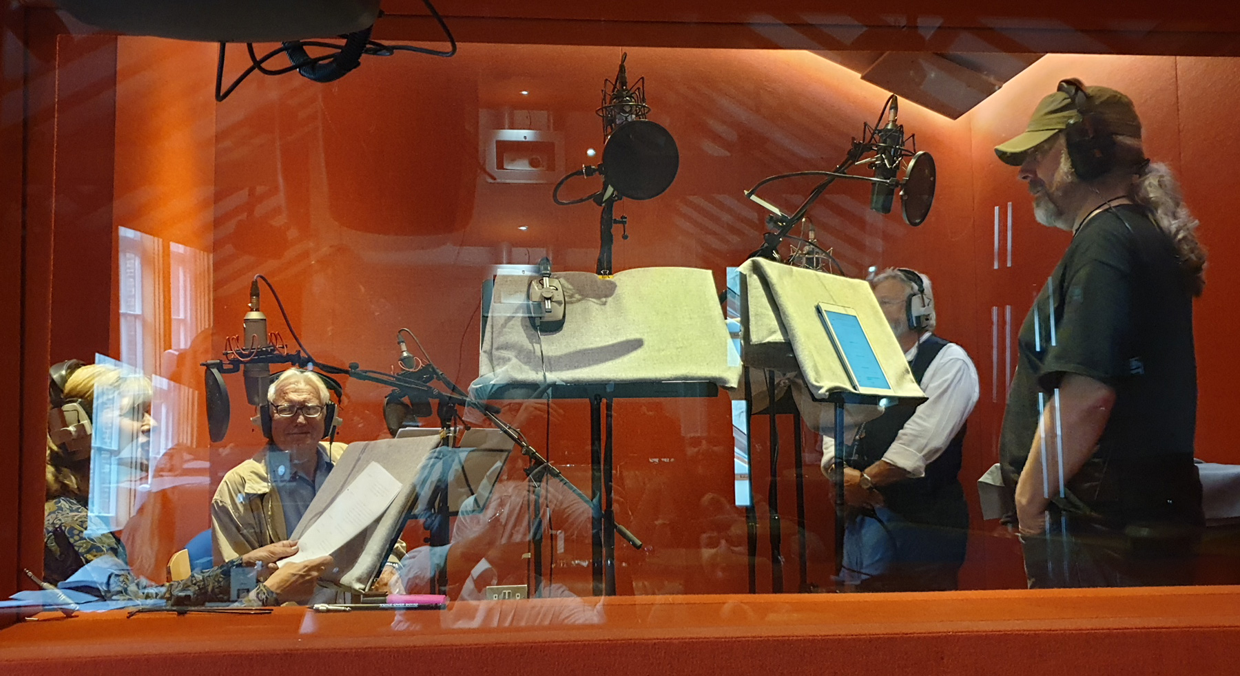 George Lazenby with fellow actors in the recording studio.